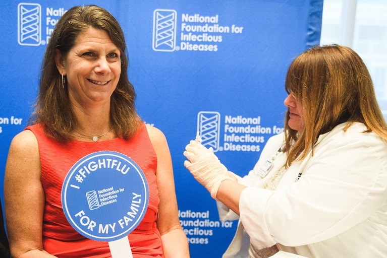 Kathleen M. Neuzil getting vaccinated