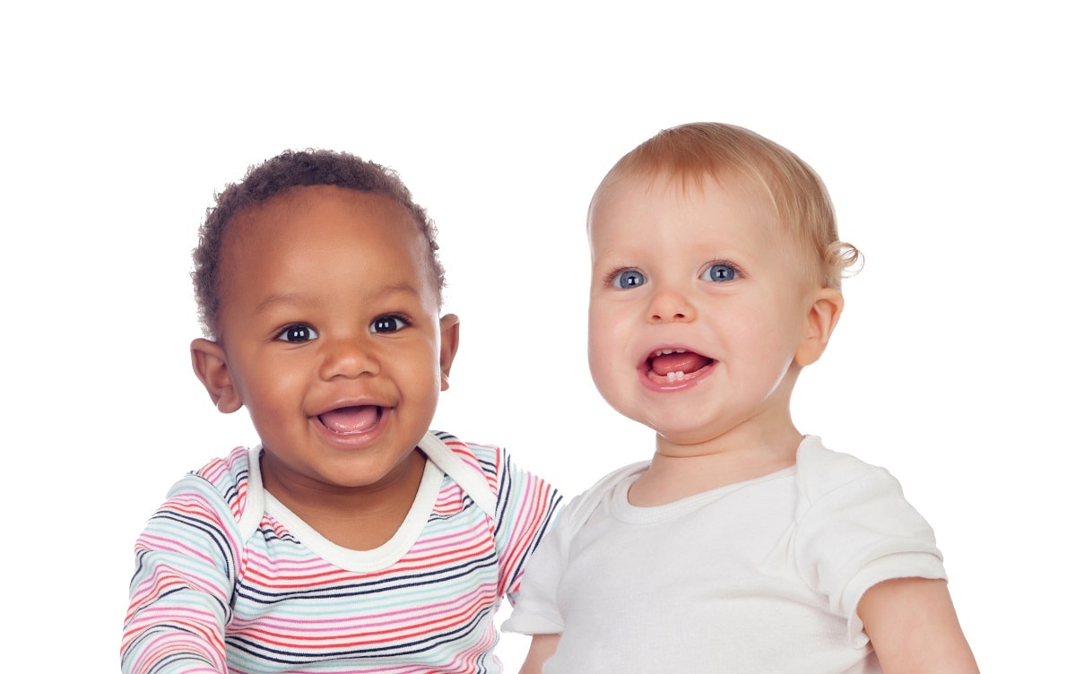 Couple of Babies African and Caucasian laughing