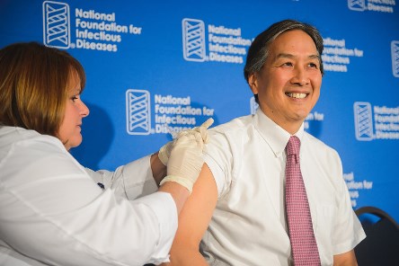 Howard K. Koh, MD, Assistant Secretary of Health, receives his annual flu vaccine