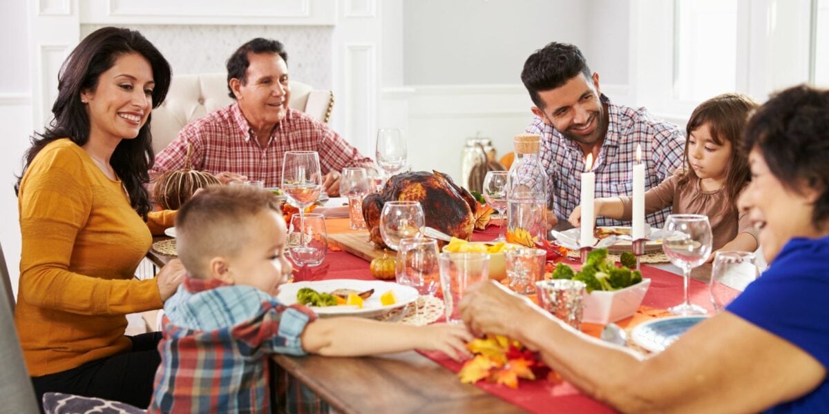 Family Thanksgiving meal at dinner table