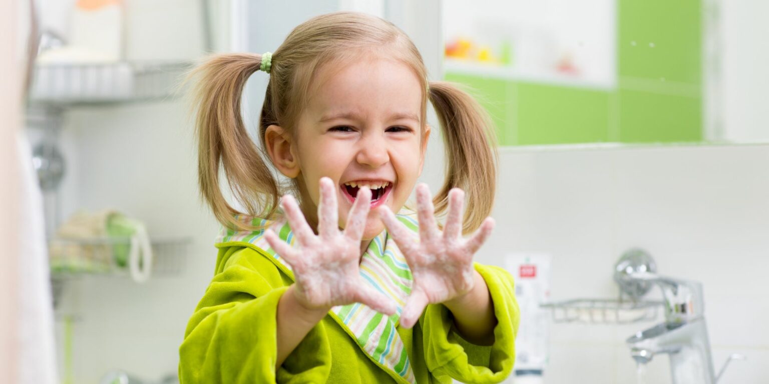 Girl Handwashing Girl washing hands with soap and water
