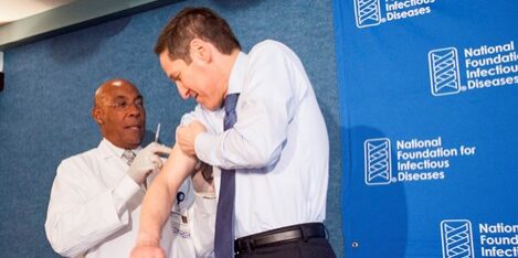 Dr. Tom Frieden, Director of the Centers for Disease Control and Prevention, right, receives a flu vaccination from nurse B.K. Morris during a press conference addressing the need for flu vaccinations Thursday September 17, 2015 at the National Press Club, Washington, DC.

©Lindsay King Photography/2015