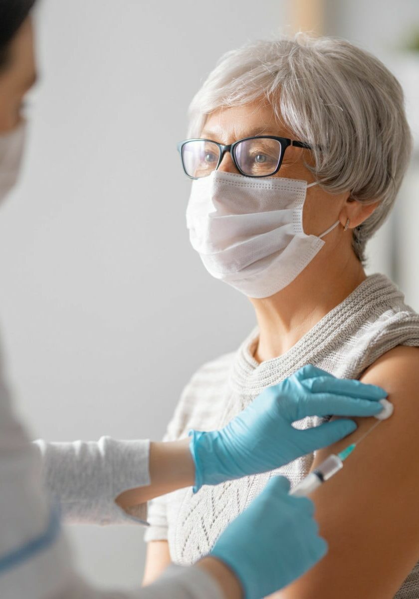 Woman receiving a vaccine in her arm