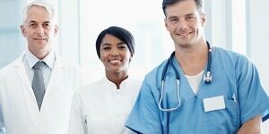hcp-team-photo300x178 Group of successful multi ethnic medical professionals smiling while standing together side by side