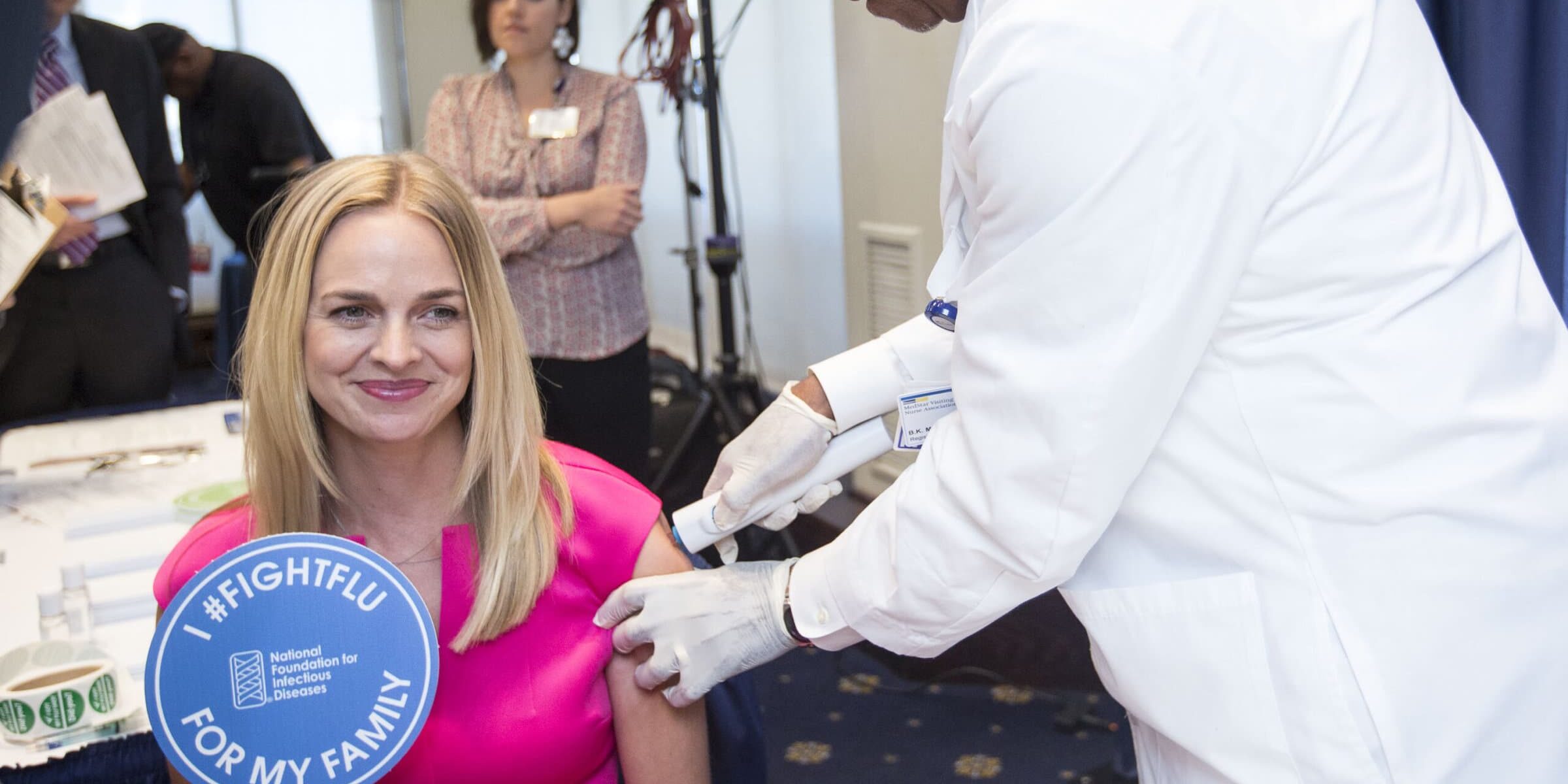 Dr. Wendy Sue Swanson, Seattle Children's, left, receives a flu vaccination from nurse Veronica Poindexter during a press conference addressing the need for flu vaccinations Thursday September 17, 2015 at the National Press Club, Washington, DC.

©Lindsay King Photography/2015